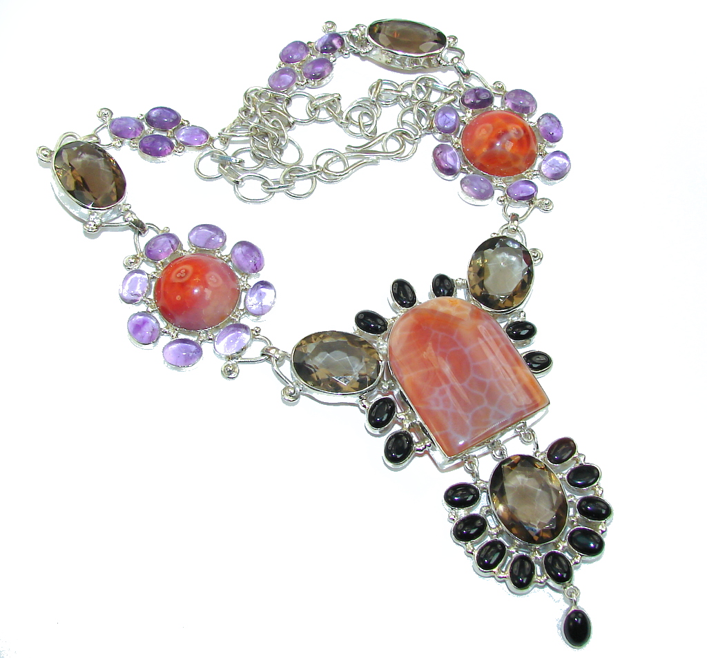 Handmade Artisan Sterling Silver 925 Necklace with unique one of a kind Magic Fire Topaz,  69.00 grams of marvelous handcrafted jewelry design. Only one piece availble ready to ship! It's unique worldwide necklace - simply piece of art in world of fine jewelry. Chunky Aura Of Beauty Mexican Fire Agate Sterling Silver necklace  NECKLACE DETAILS: Weight: 69.00g; Material: Sterling Silver; Main stone: Magic Fire Topaz; Other stones: Amethyst, Smoky Topaz, Onyx; Inner circumference: 20 inch; Drop Part: 3 1/8 inch; Clasp: S; Stamp / Mark: 925; Condition: New; Main color: orange; Shape: Multi-shape; Collection: Agra;  Item Code: 24-mar-16-2
