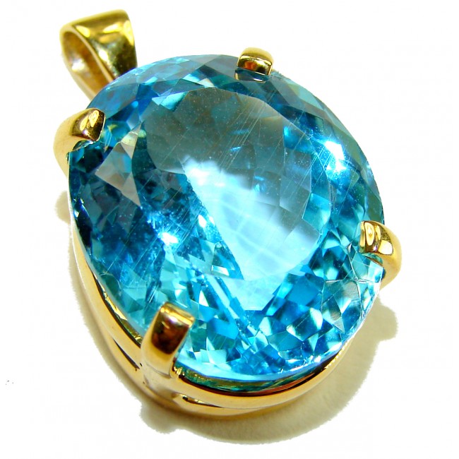 Atlantica oval cut 18.9 carat Swiss Blue Topaz 18K Gold over .925 Sterling Silver Handcrafted Pendant