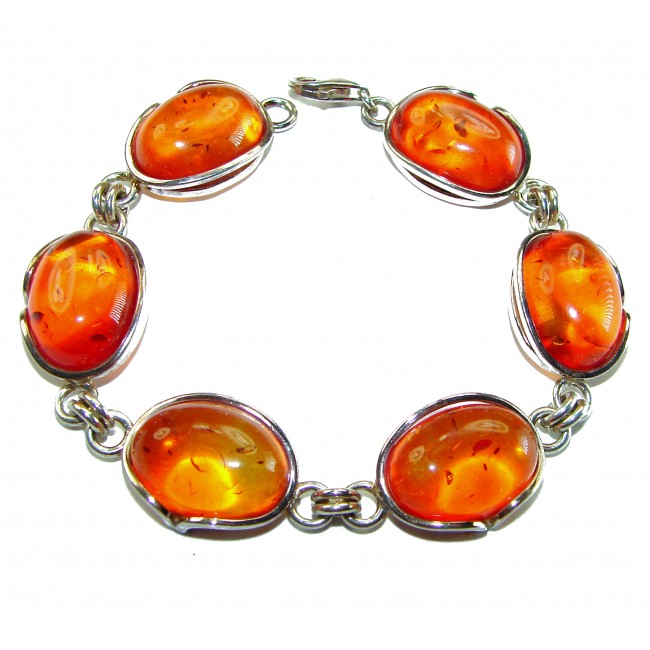 Excellent quality Baltic Amber .925 Sterling Silver entirely handcrafted Bracelet - Bracelet with oval Baltic amber stones in silver settings, top view.