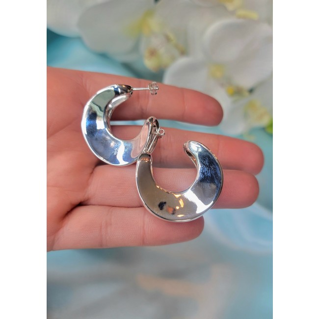 LARGE - EXTRAVAGANZA - Highly Polished Fancy .925 Sterling Silver Italy made Earrings - Close-up of polished crescent-shaped silver earrings in hand.