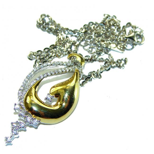Elegance 4.2 carat White Topaz 14K Gold over .925 Sterling Silver handcrafted necklace - Gold and silver pendant with white topaz, chain entwined, top view.