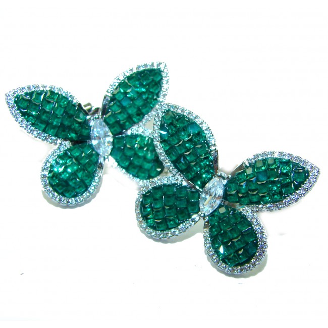 Incredible Butterflies genuine 15.2 carat Emerald .925 Sterling Silver handcrafted Earrings - Butterfly-shaped emerald earrings, top view, on white background.