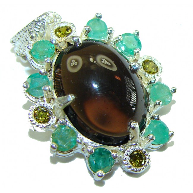 Smoky Topaz Brazilian 8.5 carat Smoky Topaz 2 tones .925 Sterling Silver handmade Pendant - Close-up of a smoky topaz pendant with green and yellow gemstones.