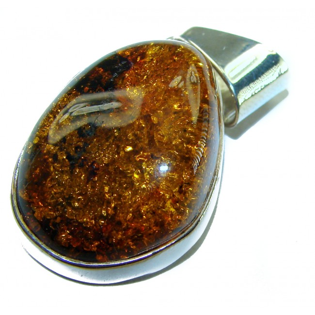 Golden natural Baltic Amber .925 Sterling Silver handmade Pendant - Close-up of golden Baltic amber pendant in sterling silver setting.