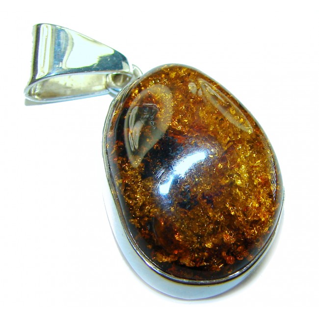 Golden natural Baltic Amber .925 Sterling Silver handmade Pendant - Close-up of golden Baltic amber pendant in sterling silver setting.