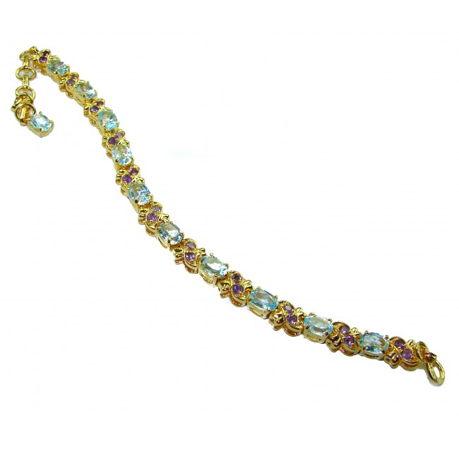 Genuine 24.5 carat Swiss Blue Topaz GARNET 14K Gold over .925 Sterling Silver handcrafted Bracelet - Side view of Swiss Blue Topaz and Garnet 14K gold bracelet.