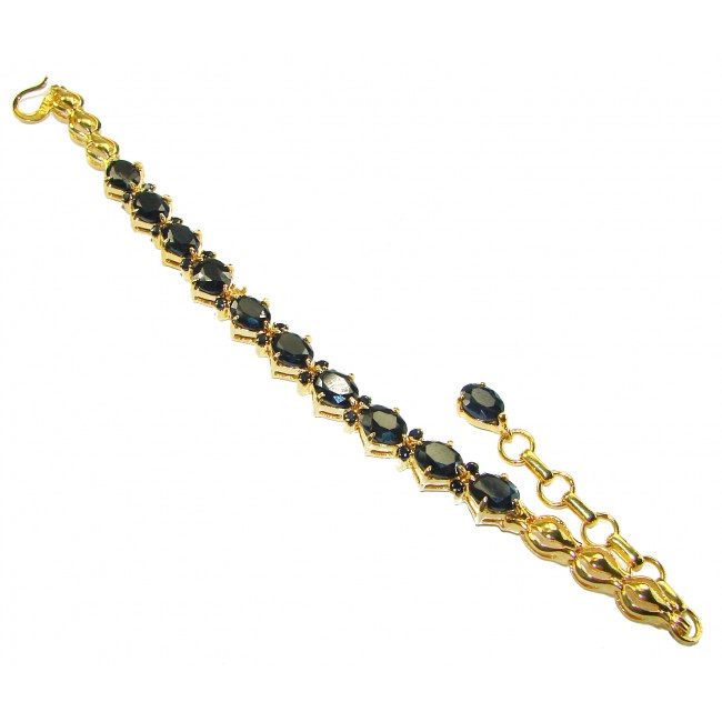 Luxurious 30.4 carat Sapphire 14K Gold over .925 Sterling Silver handcrafted Bracelet - Gold and sapphire bracelet, angled view, showing clasp and stones.