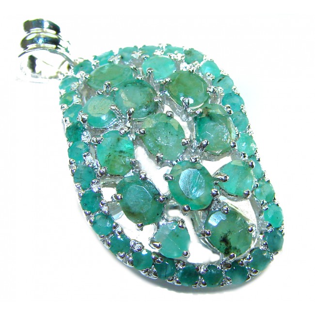 Spectacular 18.8 carat authentic Colombian Emerald .925 Sterling Silver handcrafted Pendant - Close-up of Colombian emerald pendant with silver detailing.