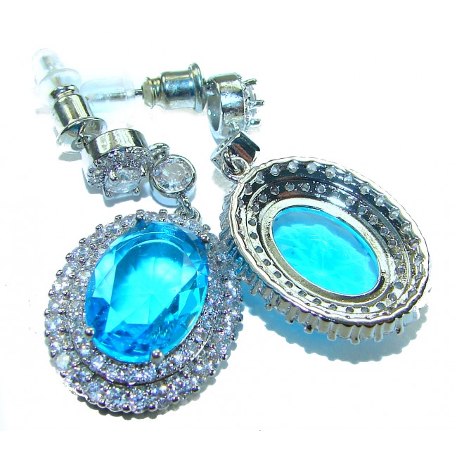 Atlantica 8.5 carat genuine Swiss Blue Topaz .925 Sterling Silver handmade Statement earrings - Close-up of blue topaz earrings with sterling silver settings.