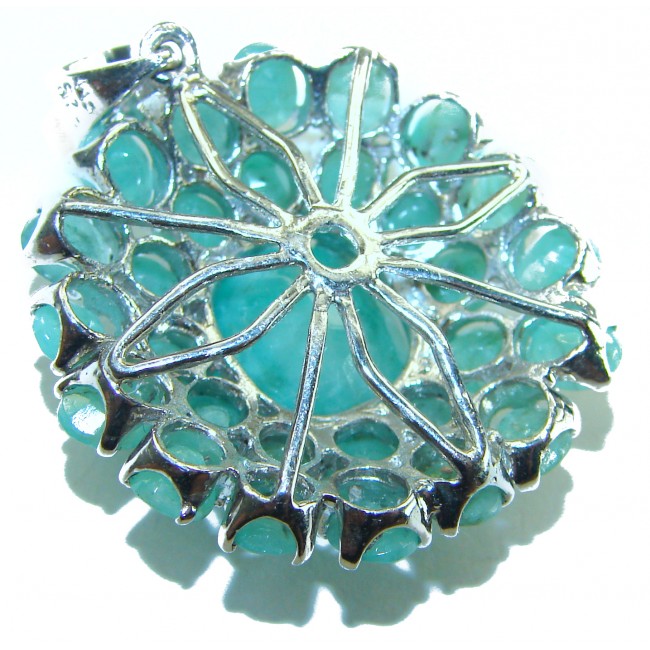 Spectacular 18.8 carat authentic Colombian Emerald .925 Sterling Silver handcrafted Pendant - Emerald jewelry close-up, showing intricate silver setting design.