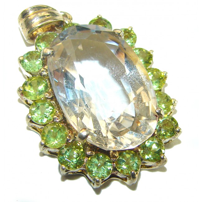 Luxury genuine 18.5 CARAT Champagne Topaz Peridot .925 Sterling Silver handmade Pendant - Close-up of champagne topaz and peridot gemstone pendant on white background.