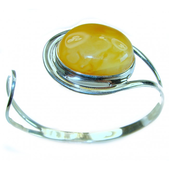 Vintage Design 21.8 grams Genuine Butterscotch Polish Amber .925 Sterling Silver handmade Bracelet / Cuff - Side view of vintage butterscotch amber bracelet with silver setting.