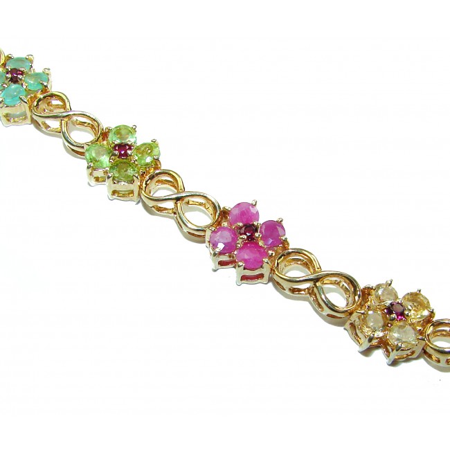 Luxurious 35.5 carat Genuine Ruby Emerald Sapphire 14 K Gold over .925 Sterling Silver Bracelet - Close-up of 14K gold bracelet with ruby, emerald, sapphire flowers.