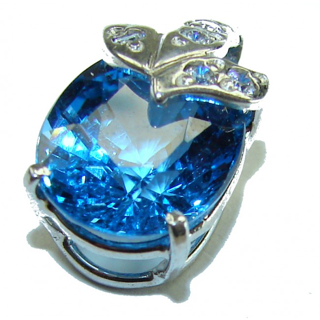 Atlantica 7.5 carat Swiss Blue Topaz .925 Sterling Silver Handcrafted pendant - Close-up of 7.5 carat Swiss Blue Topaz with silver butterfly detail