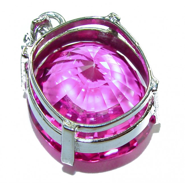 Pink Beauty - Oval cut 14.4 carat Pink Sapphire .925 Sterling Silver handcrafted pendant - Close-up of pink sapphire pendant with silver setting.