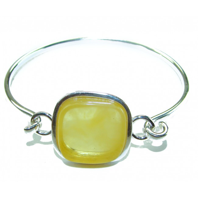 Genuine Butterscotch Polish Amber .925 Sterling Silver handmade Bracelet / Cuff - Close-up of butterscotch amber and silver bracelet against white background.