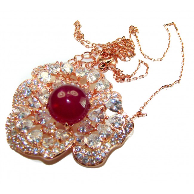 Timless Beauty- 10.5 carat authentic Ruby 18K Rose Gold over .925 Sterling Silver handcrafted necklace - Close-up of ruby pendant in gold, with sparkling gemstone accents.