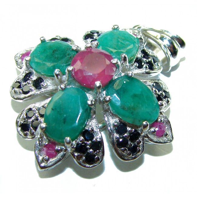 Spectacular 28.8 carat authentic Colombian Emerald .925 Sterling Silver handcrafted Pendant - Flower-shaped emerald and ruby pendant close-up, showcases stones.