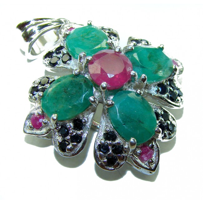 Spectacular 28.8 carat authentic Colombian Emerald .925 Sterling Silver handcrafted Pendant - Emerald flower pendant with ruby center, top view.