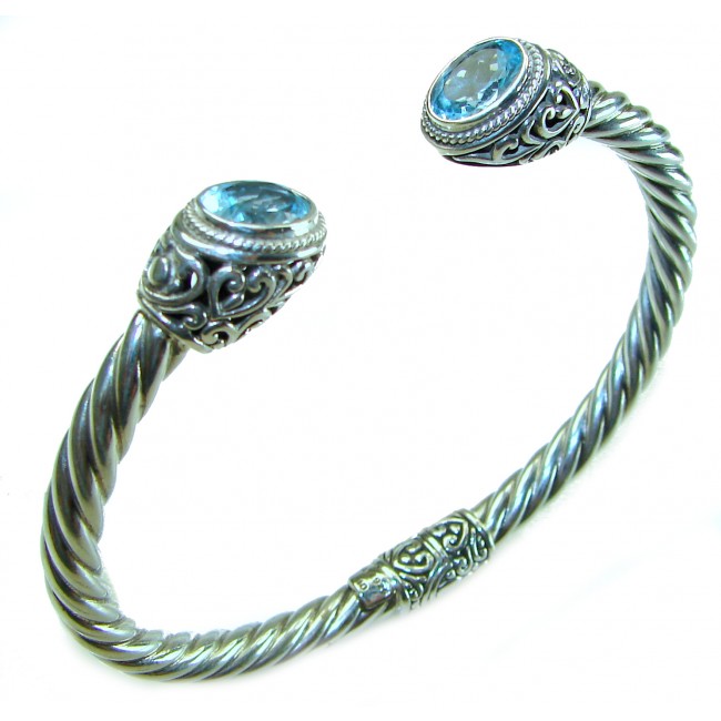 BLUE DREAMER 8.5 carat authentic Swiss Blue Topaz Floral Bracelet in .925 Sterling Silver - Silver cuff bracelet with blue topaz, front view showing details.