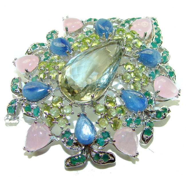 Royalty - Vintage style genuine 85.6 carat Green Amethyst .925 Sterling Silver handmade LARGE Pendant - Brooch - Close-up of vintage style green amethyst jewelry with colorful stones.