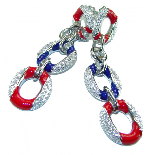 Independence - authentic 7.5 carat Ruby Sapphire .925 Sterling Silver handcrafted earrings - Close-up of silver, red, and blue linked jewelry with stone detailing.