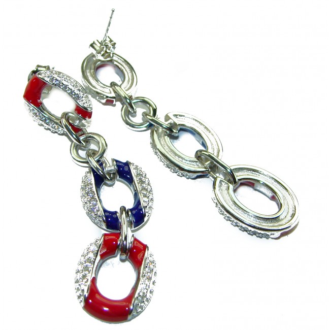 Independence - authentic 7.5 carat Ruby Sapphire .925 Sterling Silver handcrafted earrings - Dangling earrings with red, blue stones, and diamonds, close-up angle.