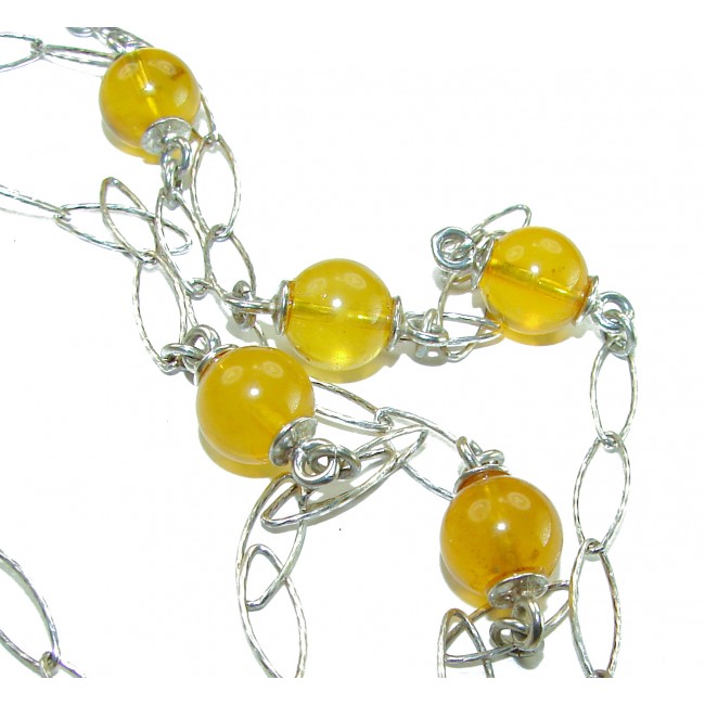 Dazzling vintage natural Baltic Amber .925 Sterling Silver handcrafted station necklace - Close-up of vintage Baltic Amber necklace with sterling silver links.