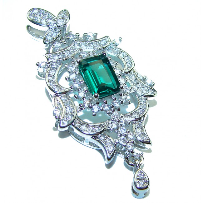 Luxurious 1.3 carat Emerald White Topaz .925 Sterling Silver handcrafted pendant - Emerald and topaz pendant, close-up, intricate silver setting.