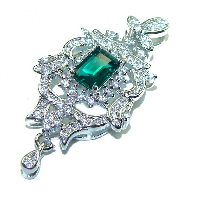 Luxurious 1.3 carat Emerald White Topaz .925 Sterling Silver handcrafted pendant - Emerald pendant with white topaz stones, top view, in sterling silver.
