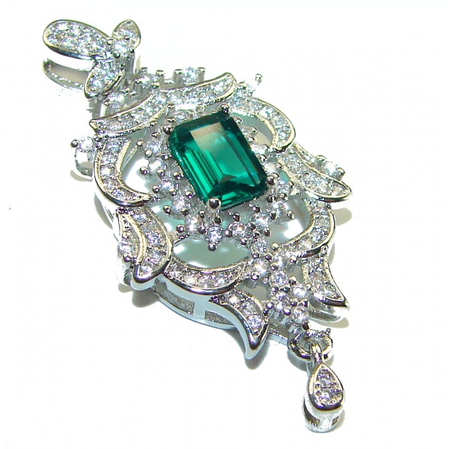 Luxurious 1.3 carat Emerald White Topaz .925 Sterling Silver handcrafted pendant - Elegant emerald pendant close-up with intricate silver detailing.