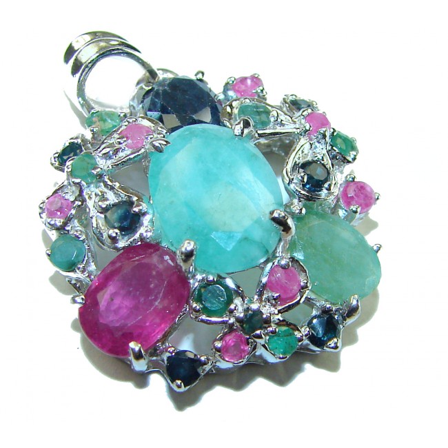 Spectacular 12.8 carat authentic Colombian Emerald .925 Sterling Silver handcrafted Pendant - Close-up of colorful gemstone pendant with emerald centerpiece.