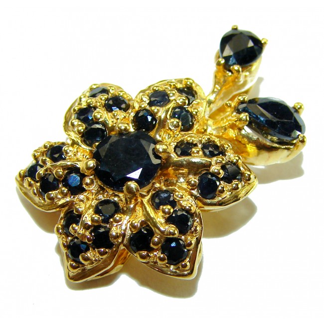 Authentic 10.5 carat faceted Sapphire 14K Gold over .925 Sterling Silver handcrafted Statement Pendant - Close-up of sapphire and gold floral jewelry piece.