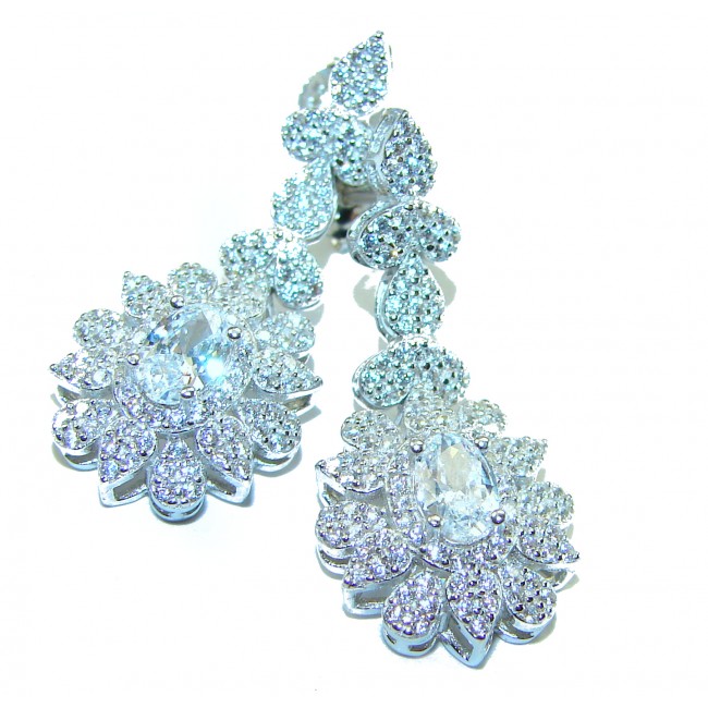 Precious genuine 7.9 carat White Sapphire .925 Sterling Silver handcrafted earrings - Close-up of white sapphire earrings on white background