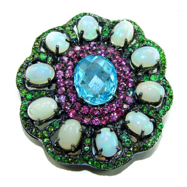 Costa del Sol oval cut 27.8 carat Ethiopian Opal Swiss Blue Topaz .925 Sterling Silver Handcrafted Pendant - Close-up of Costa del Sol pendant with opal and blue gemstone.