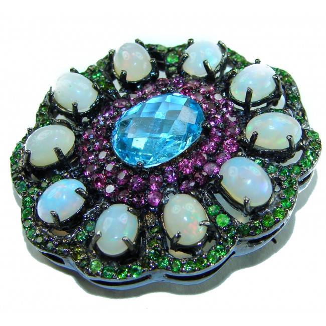 Costa del Sol oval cut 27.8 carat Ethiopian Opal Swiss Blue Topaz .925 Sterling Silver Handcrafted Pendant - Close-up of Costa del Sol brooch featuring opals and Swiss Blue gemstone