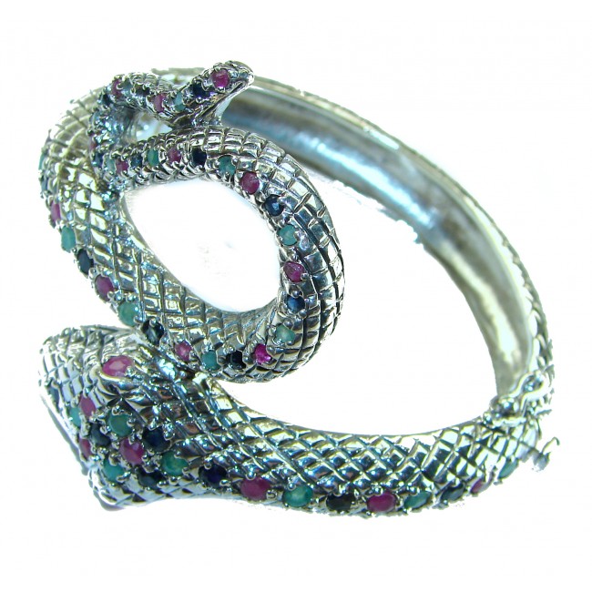 Huge 54.2 carat Precious Snake Genuine Ruby Emerald Sapphire .925 Sterling Silver handcrafted Bracelet - Snake-shaped bracelet with rubies, emeralds, and sapphires, side view.