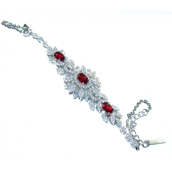7.5 carat Ruby .925 Sterling Silver handmade Statement Bracelet - Top view of ruby and silver statement bracelet on white background.