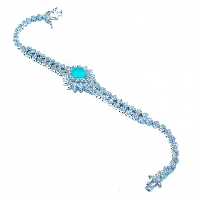 Beauty of Nature- natural 6.5 carat Emerald .925 Sterling Silver handmade Statement Bracelet - Bracelet with emerald center stone, top view, on white background.