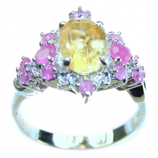 Luxurious 4.5 carat yellow Sapphire .925 Sterling Silver handcrafted ring; s. 6 - Close-up of yellow sapphire ring with pink accents on silver band.