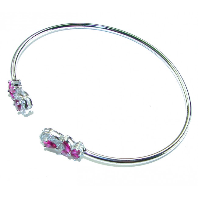 Spectacular 5.5 carat authentic Ruby .925 Sterling Silver handmade bangle Bracelet - Open bracelet with rubies and silver detail, overhead view.