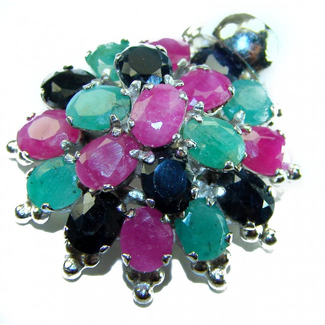 Floral-inspired authentic 10.5 carat Ruby Sapphire .925 Sterling Silver handcrafted Pendant - Close-up of floral-inspired gemstone brooch with rubies and sapphires.