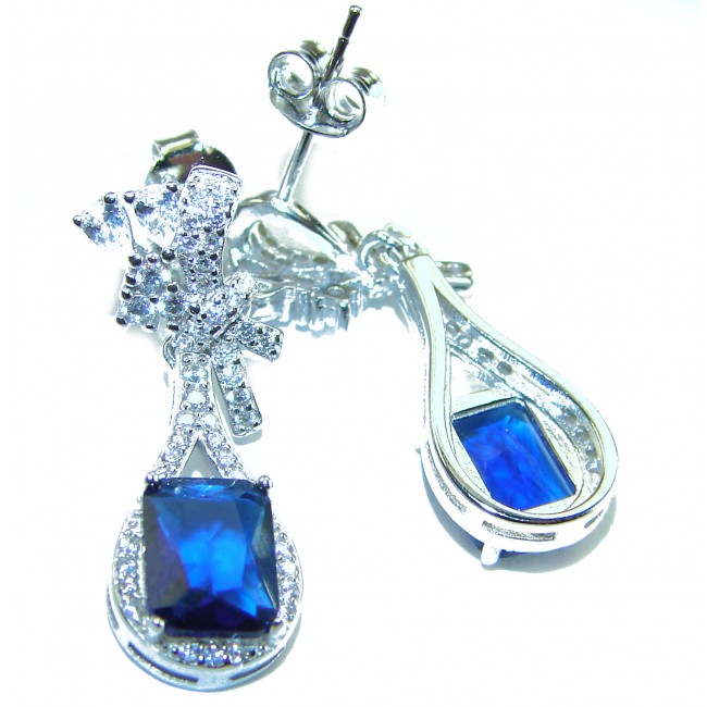 Pear cut 4.5 carat Sapphire .925 Sterling Silver handcrafted incredible earrings - Close-up of sapphire earrings in sterling silver with teardrop design.