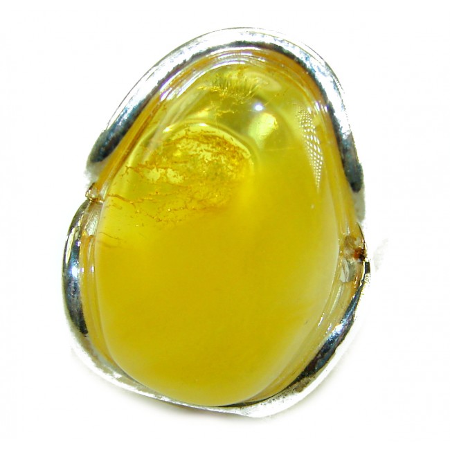Authentic Golden Butterscotch Baltic Amber .925 Sterling Silver entirely handcrafted ring; s. 7 adjustable - Close-up of authentic golden butterscotch Baltic amber in silver setting.