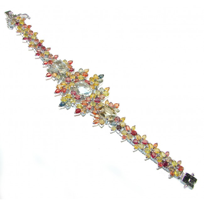 Magnificent 102.5 carat yellow Sapphire .925 Sterling Silver handcrafted Bracelet - Colorful yellow sapphire bracelet on white background, top view.