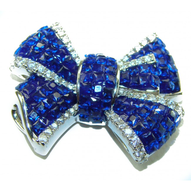 Heirloom blue Bow Genuine 17.5 carat Sapphire .925 Sterling Silver handmade Pendant - Blue sapphire bow brooch, close-up, with sterling silver details.