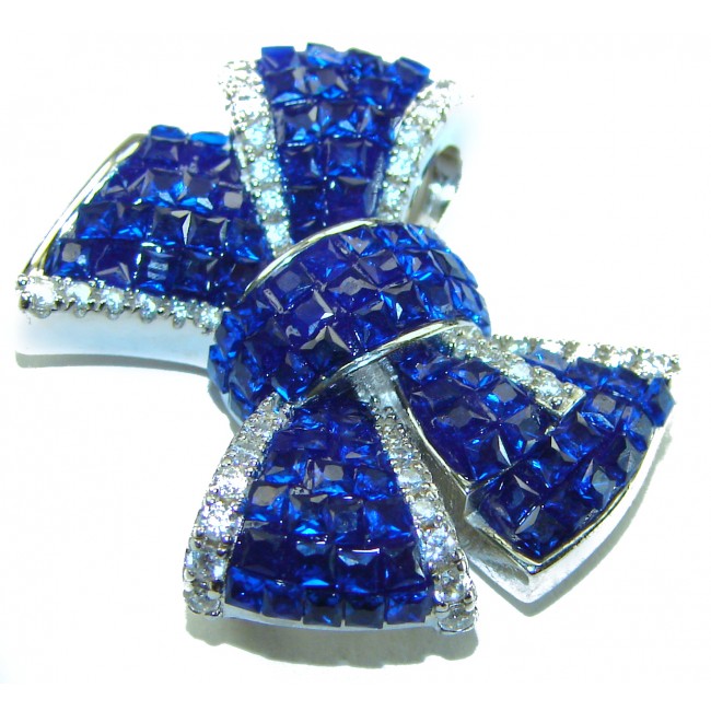 Heirloom blue Bow Genuine 17.5 carat Sapphire .925 Sterling Silver handmade Pendant - Close-up of heirloom blue sapphire bow brooch with diamond accents.