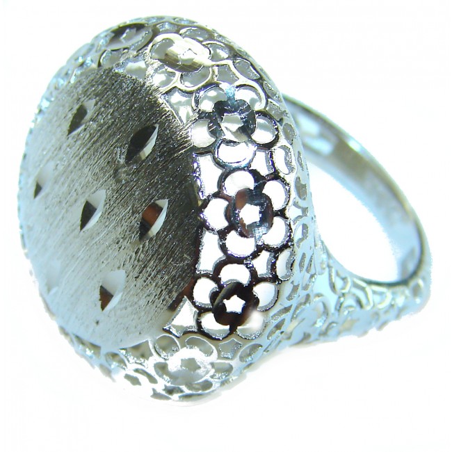 Casablanca Italy made .925 Sterling Silver brilliantly handcrafted ring s. 7 1/4 - Sterling silver ring with floral cutouts, angled side view.