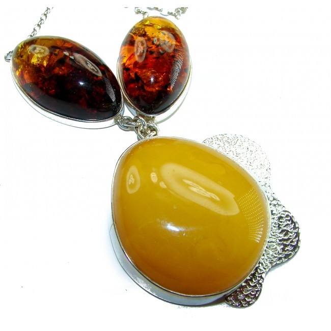 Rare Creation - natural Baltic Amber .925 Sterling Silver handcrafted necklace - Close-up of natural Baltic amber pendant with sterling silver setting.
