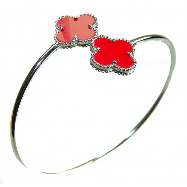 A Red four-leaf clover Coral .925 Sterling Silver handcrafted Bracelet - Red four-leaf clover coral bracelet, side view, sterling silver band.